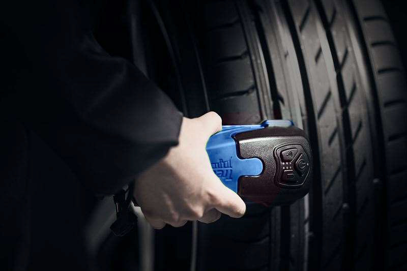 Treadreader Handheld on a tyre for wheel alignment check