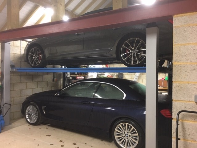 A fun one to finish! This Cascos C430 four post lift has been installed for storage purposes. The vehicle lift allows space for  an extra vehicle and is able to fit in the tightest of spaces.